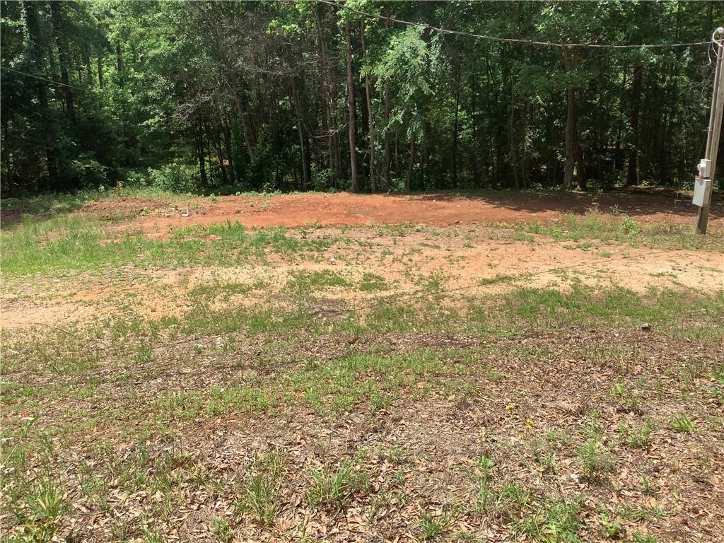 Image 3: A spacious lot offering ample room for a custom bu