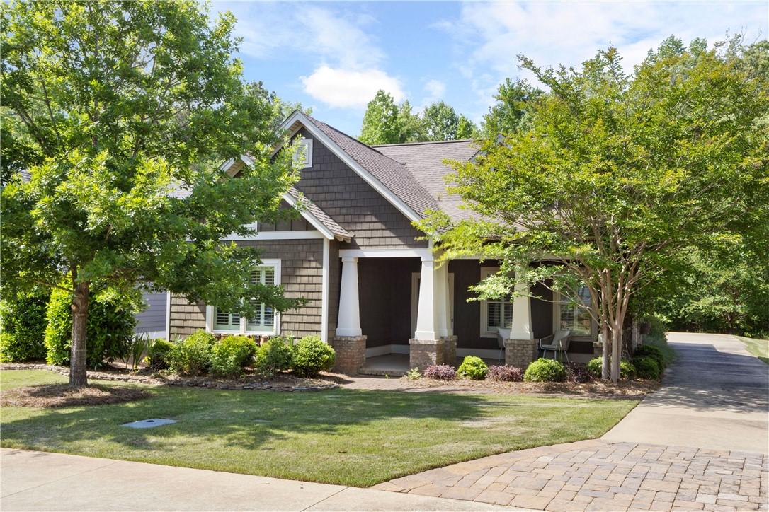 Image 2: An inviting front elevation with a covered porch a
