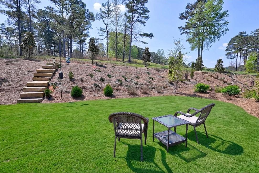 Image 3: Backyard with private steps leading to nature trai
