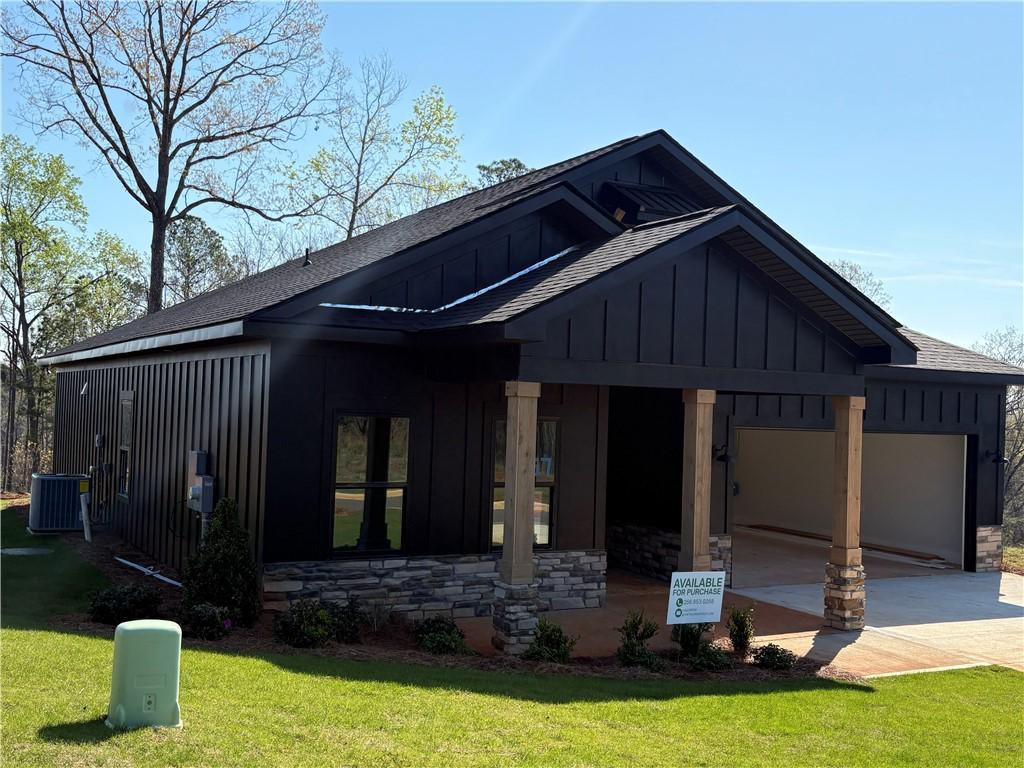 Image 3: This newly constructed home features a contemporar