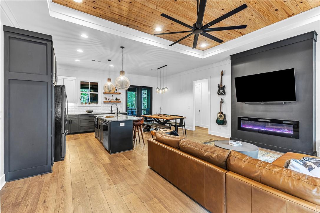 Image 4: An open-concept great room offers high ceilings wi