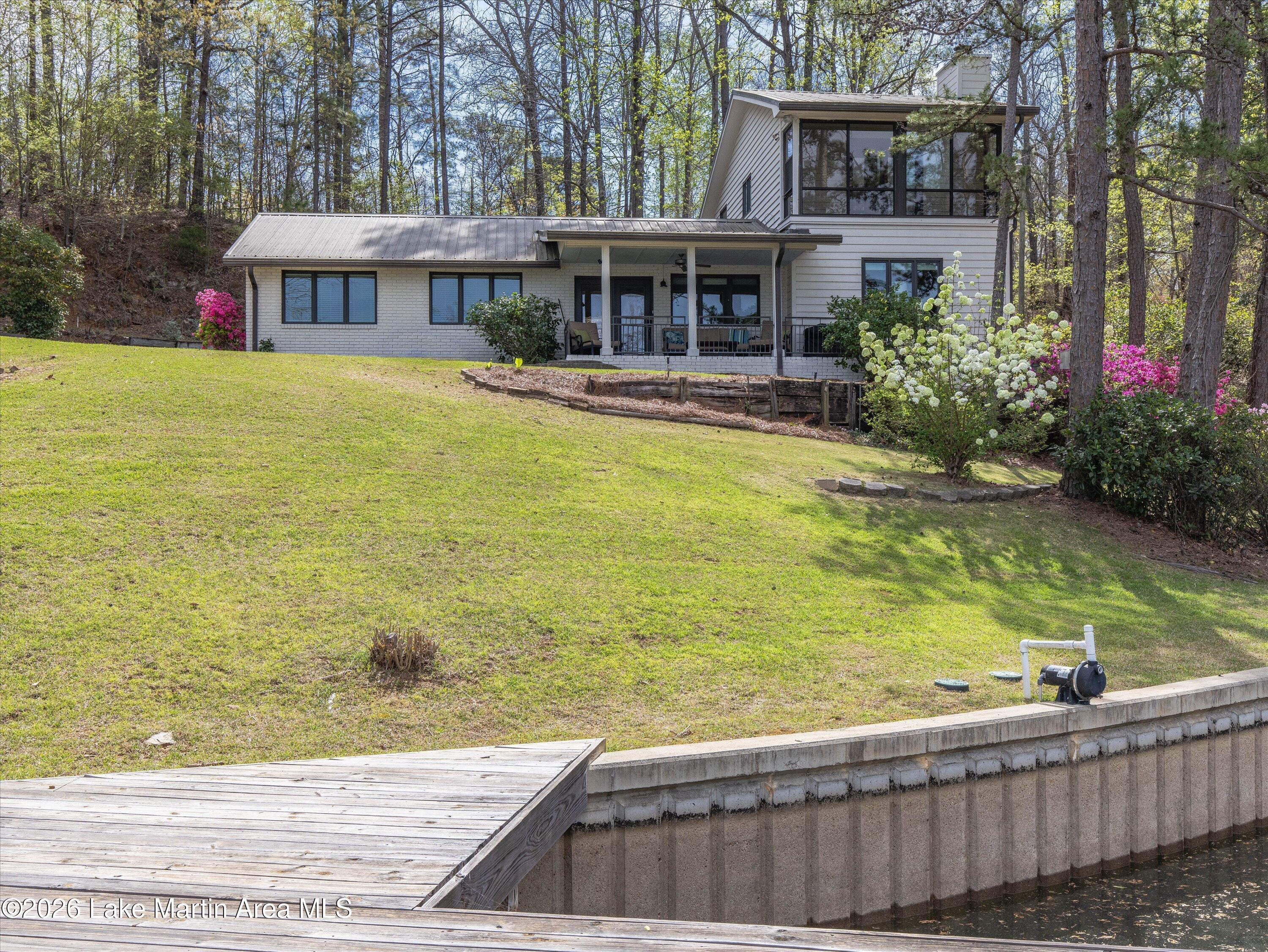 Image 1: Lakeside view of home