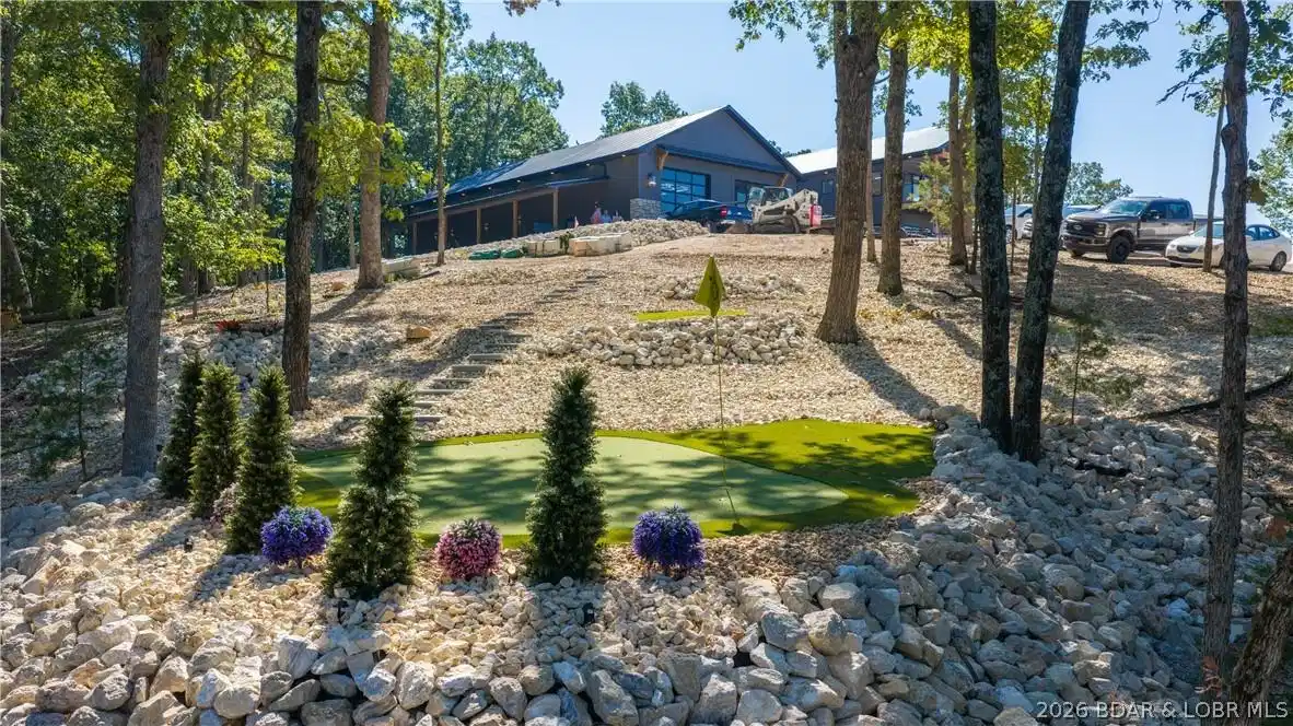 Image 1: View of the estate from a lower golf greens
