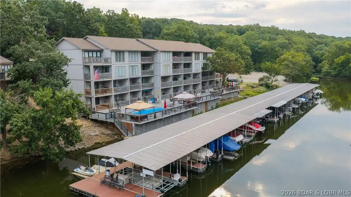 Image 1: Stunning lakeside view featuring the gorgeous cond