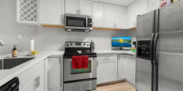Image 4: Kitchen featuring an open-concept layout, custom c