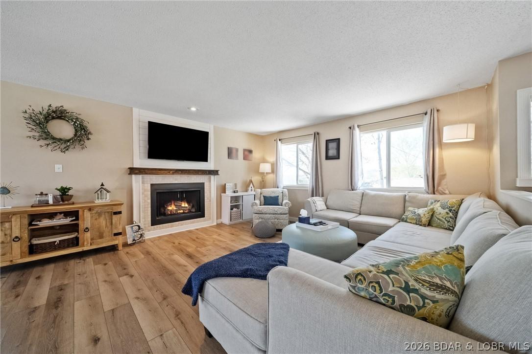 Image 1: Unwind in your spacious and open living room.