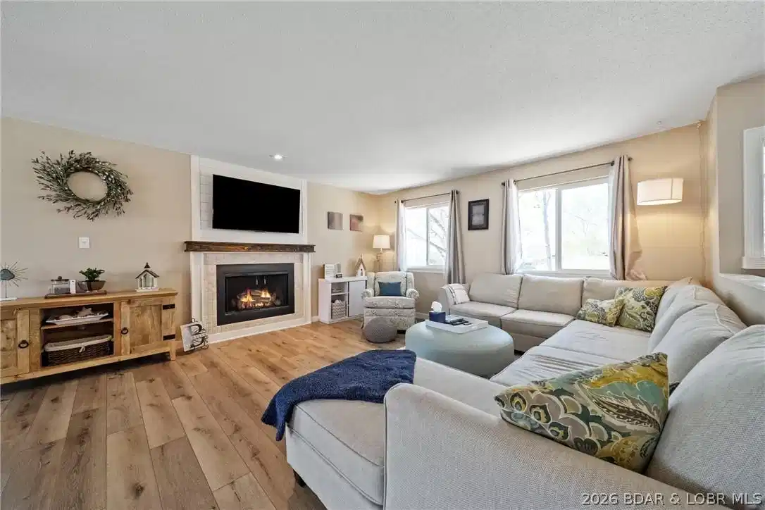 Image 1: Unwind in your spacious and open living room.