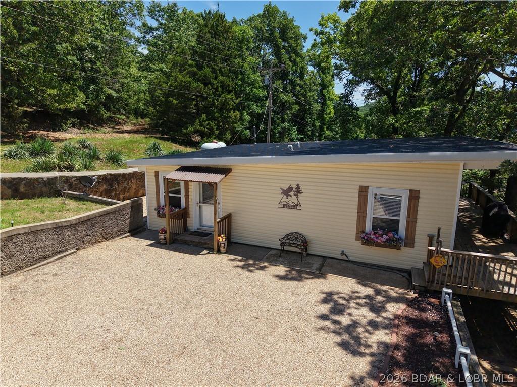 Image 3: A very charming home in the woods just up the stre