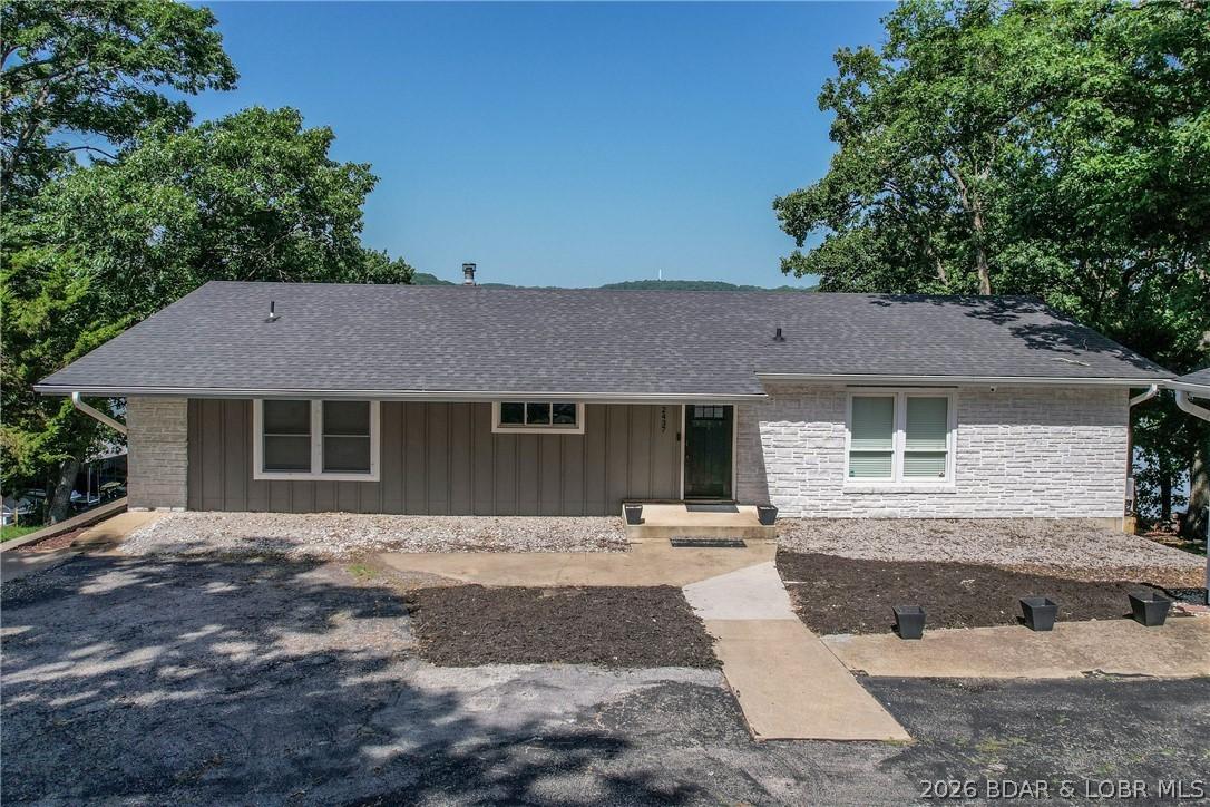 Image 3: Level driveway with detached 3 car garage