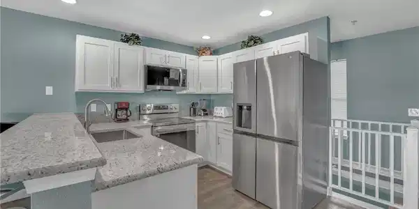 Image 4: Kitchen is all new appliances, cabinets, granite c