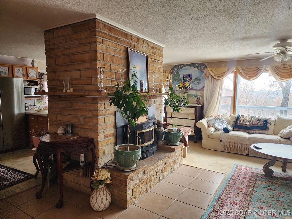 Image 2: main floor living room with wood burning stove