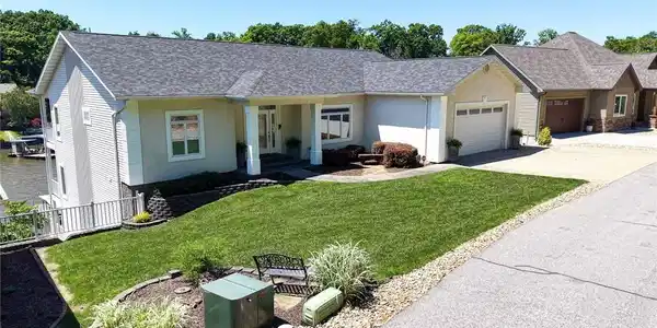 Image 4: Additional parking to the right of the home