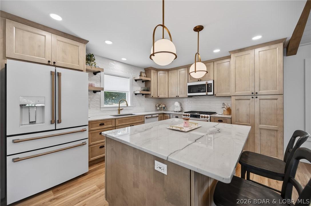 Image 2: Beautifully remodeled kitchen with granite counter