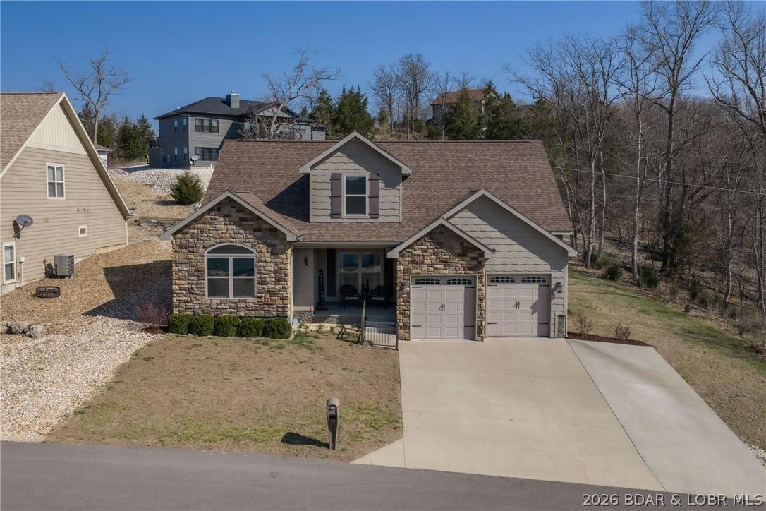 Image 2: Low maintenance exterior, 2 car garage, and guest