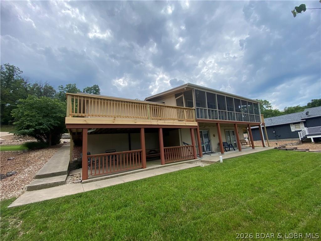 Image 3: Expansive Deck & Lush Flat Yard