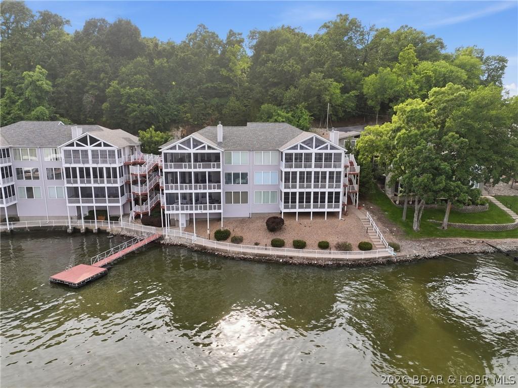 Image 2: View from lake. Top floor, left of building