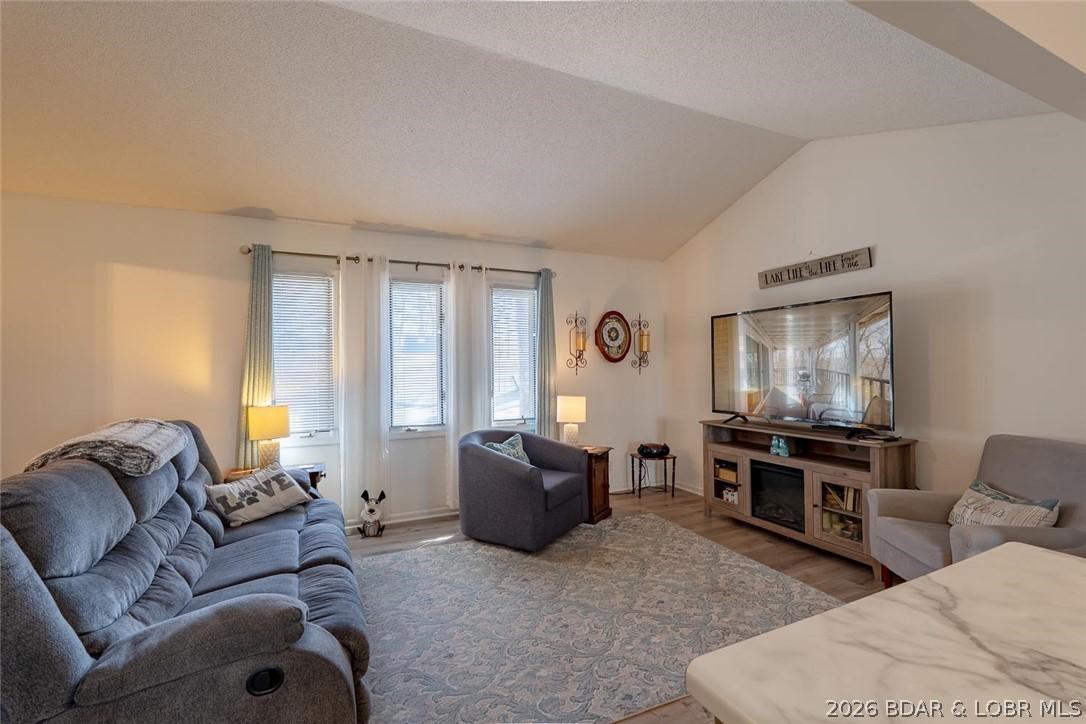 Image 4: Main level living area has vaulted ceilings