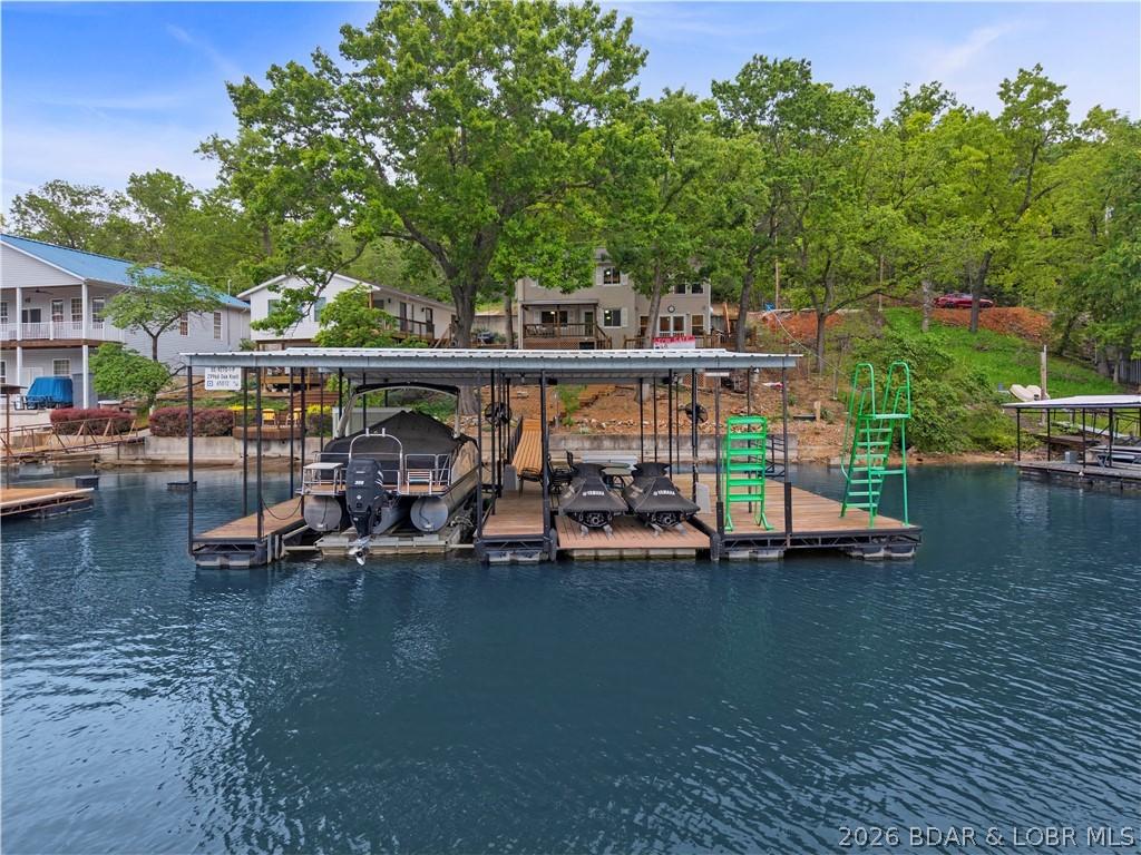 Image 2: Newer 10,000 lb boat lift and 2 newer PWC lifts ar