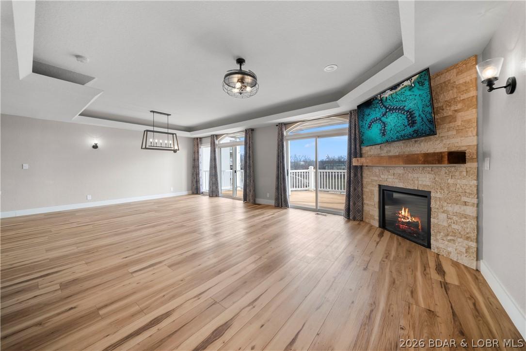 Image 2: Stone Fireplace + Open Concept Living