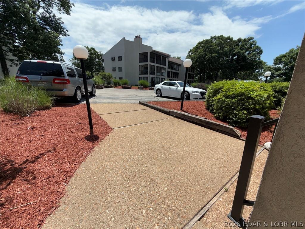 Image 3: One step down into court yard!