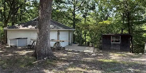 Image 4: Two car detached garage and storage shed