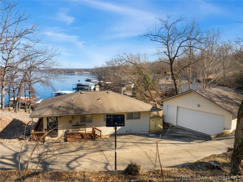 Image 3: Roadside View of Home & Garage