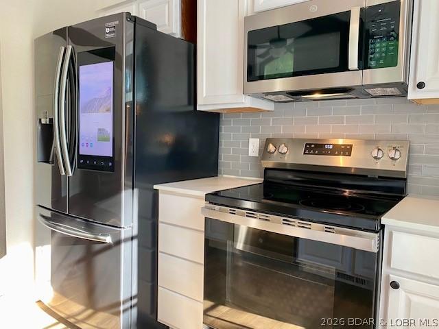 Image 3: The kitchen adorns newer appliances, including a S