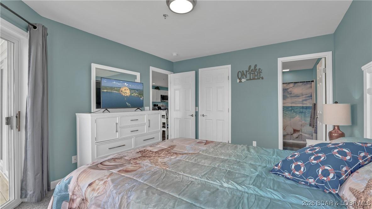 Image 2: Master suite offers a private bath and deck access
