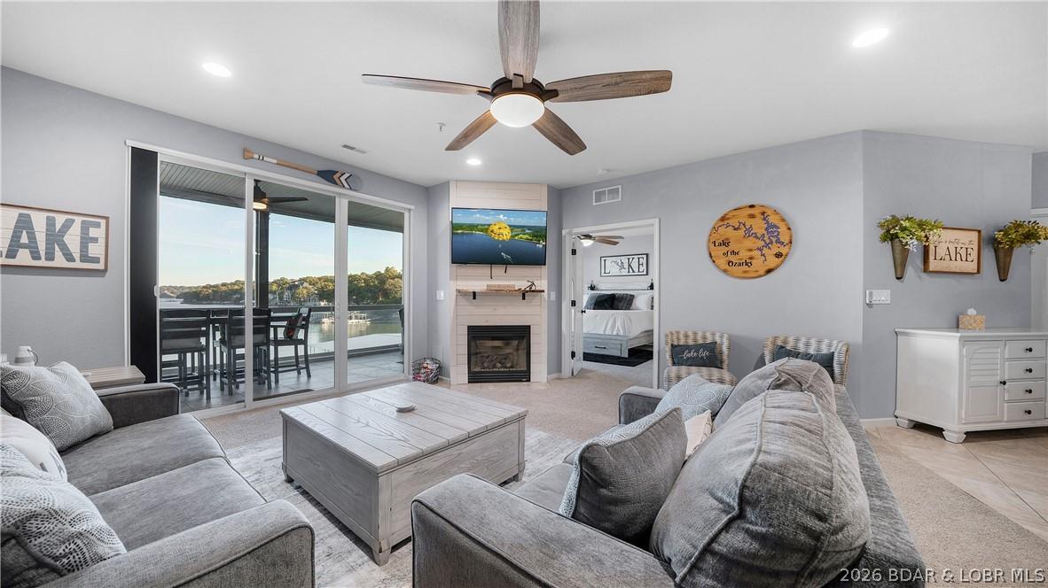 Image 1: Living room with unparalleled lake view
