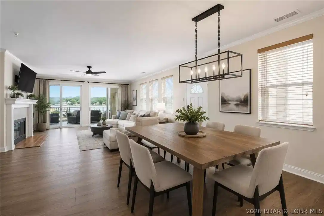 Image 1: Virtually staged Dining Area and Living Room