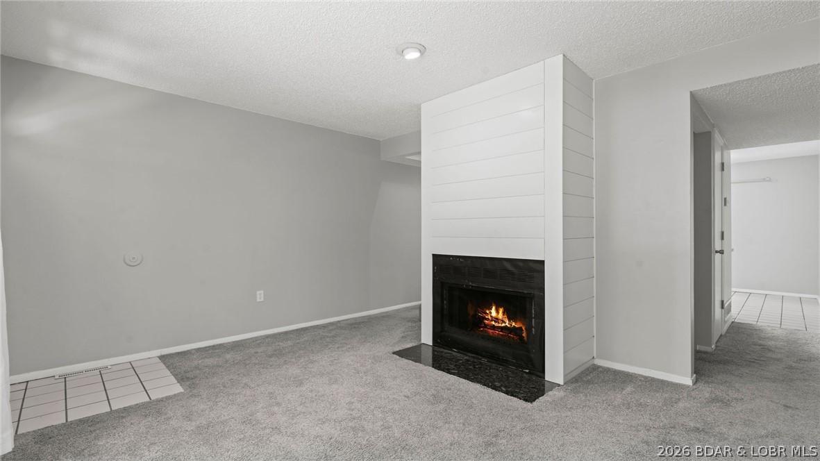 Image 3: Main Level Living area with electric fireplace.