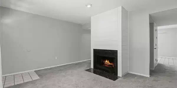 Image 3: Main Level Living area with electric fireplace.