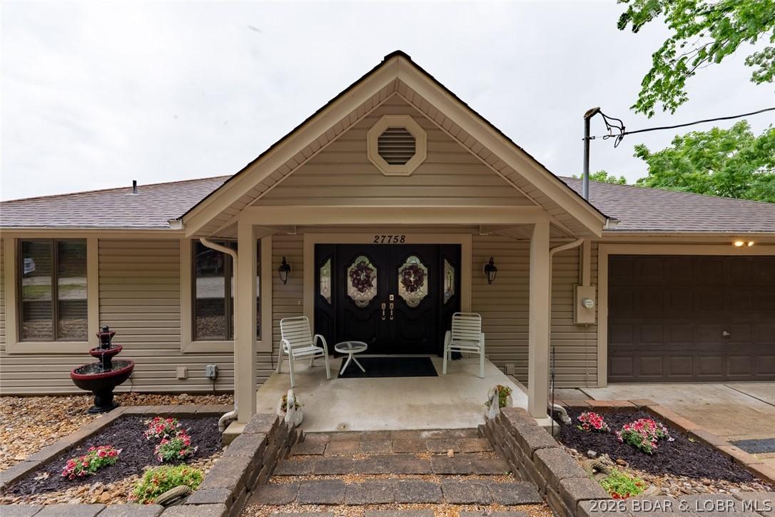 Image 2: Covered front porch on the roadside