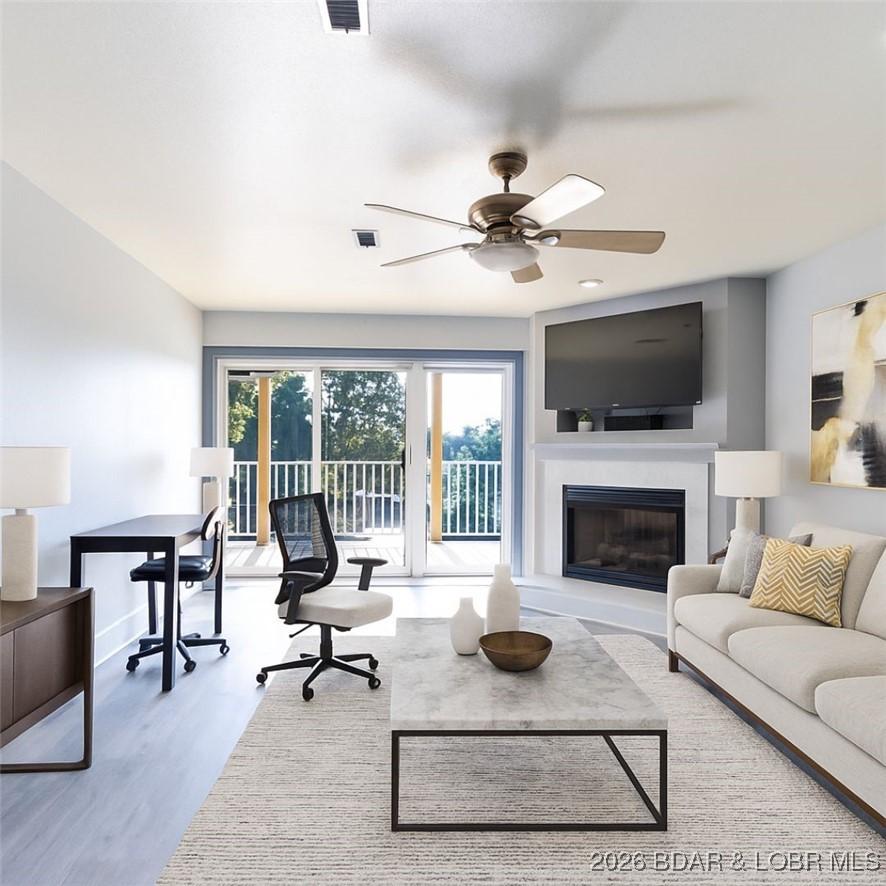 Image 1: Virtually Staged living area, to walk out deck.