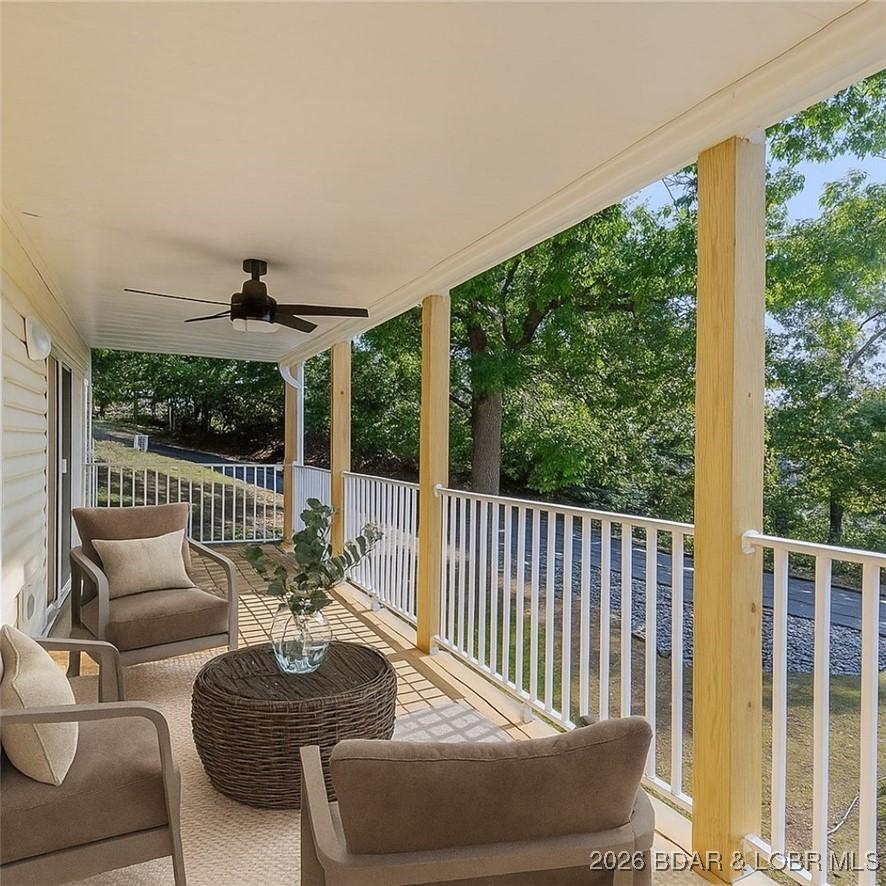 Image 2: Virtually Staged Large deck overlooking pool.