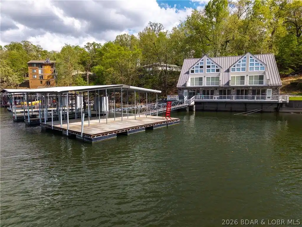 Image 1: Property sits perched on waters edge. Can't get an