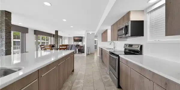 Image 3: Large open kitchen seamlessly connects to great ro
