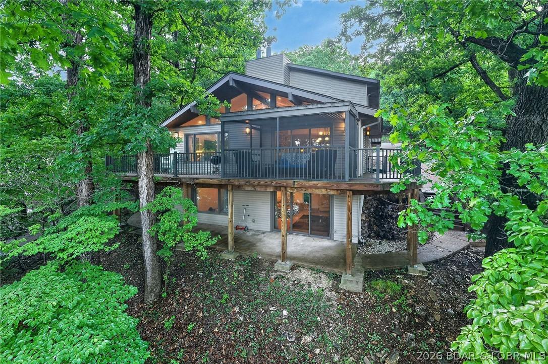 Image 1: Home is Nestled in the Trees
