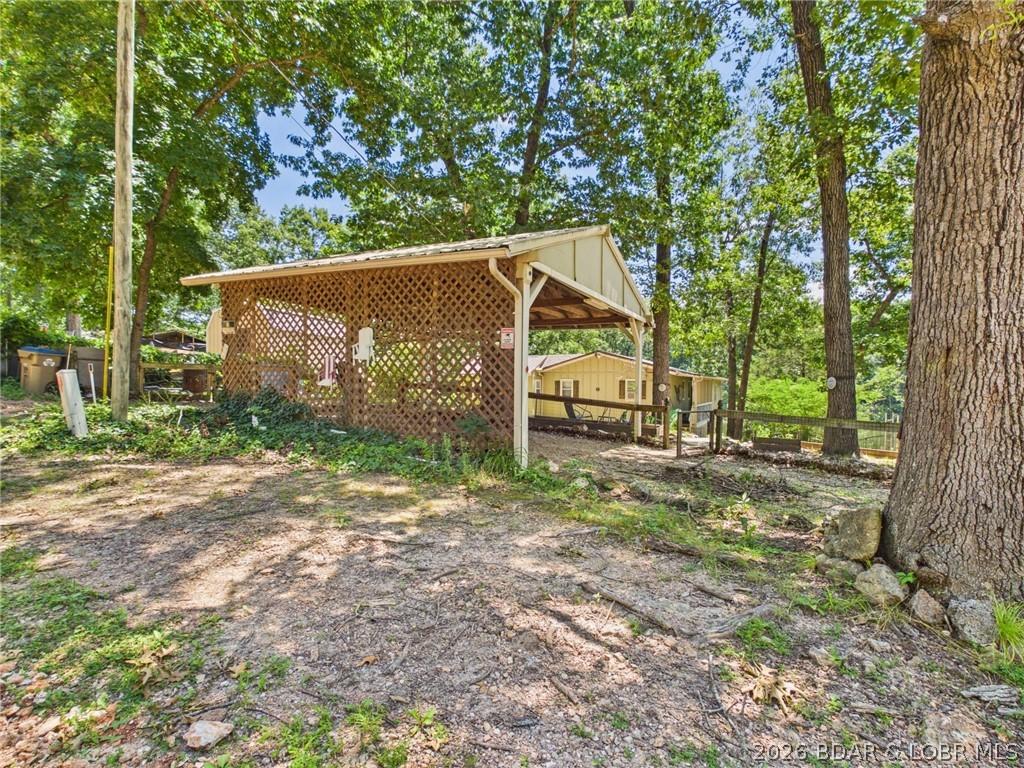Image 2: 18x19 carport keeps your vehicles out of the weath