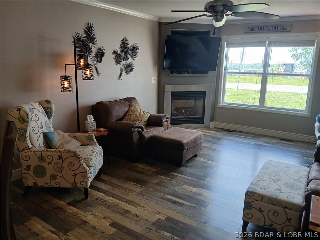 Image 2: .... living room with corner fireplace.