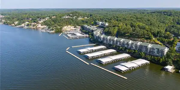 Image 3: Stunning view of the lake shoreline featuring comm