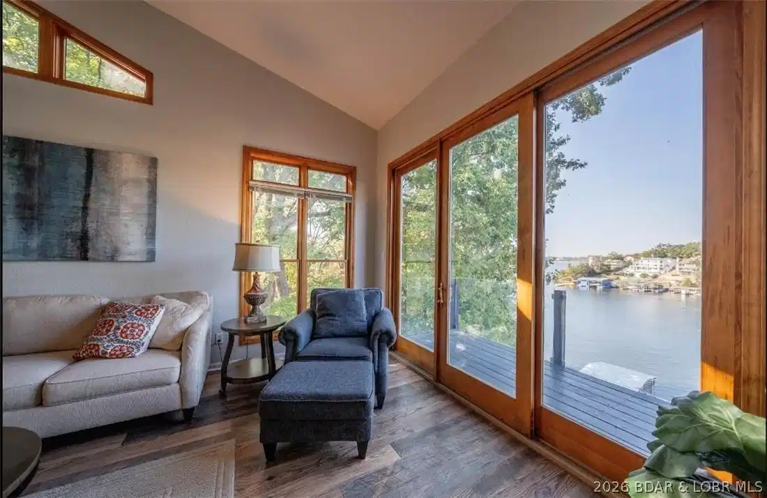 Image 1: Relaxing screened porch overlooking the lake