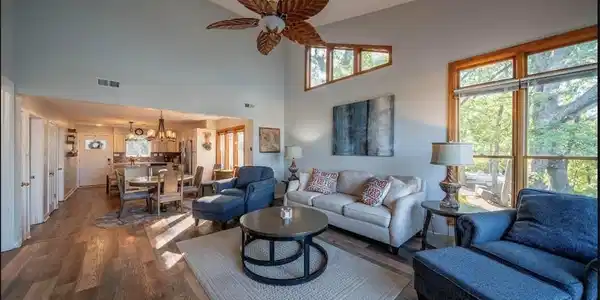 Image 2: Bright living room with large windows