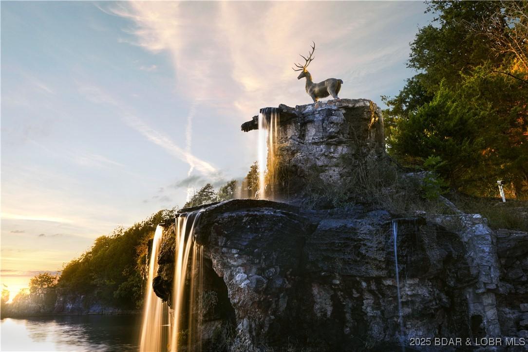 Image 1: Iconic rock waterfall cascading into the lake, cr