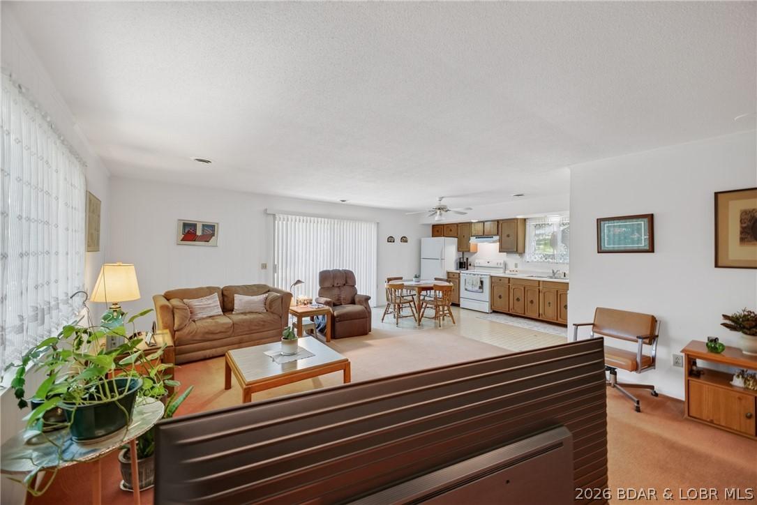 Image 4: Spacious living/ dining area with open concept kit