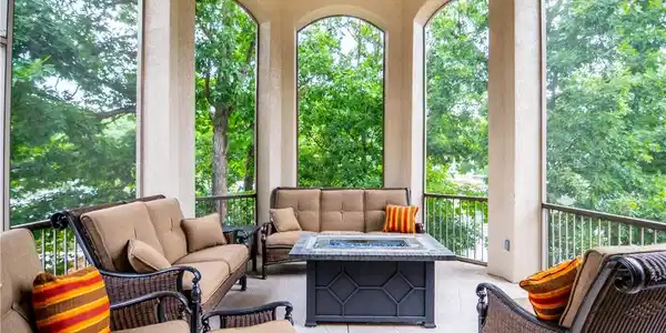 Image 2: This outdoor screened porch off of the dining area