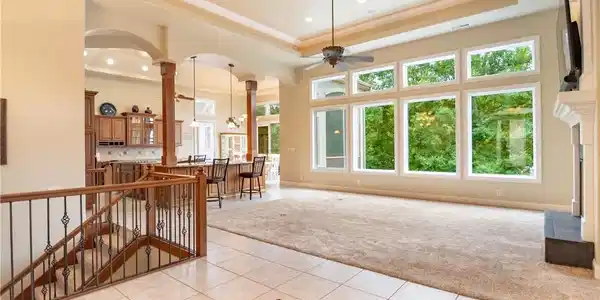 Image 3: These tall ceilings and transom windows allow in s