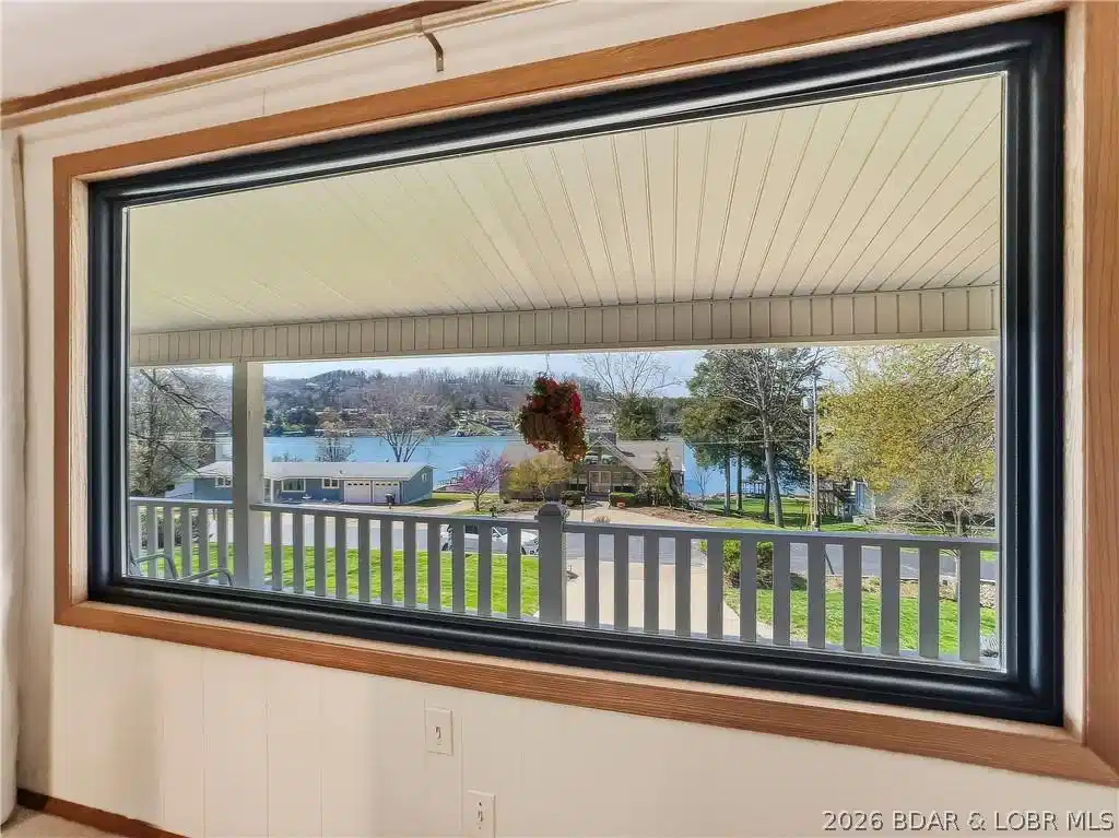 Image 1: Lake view from every window on the front of this h