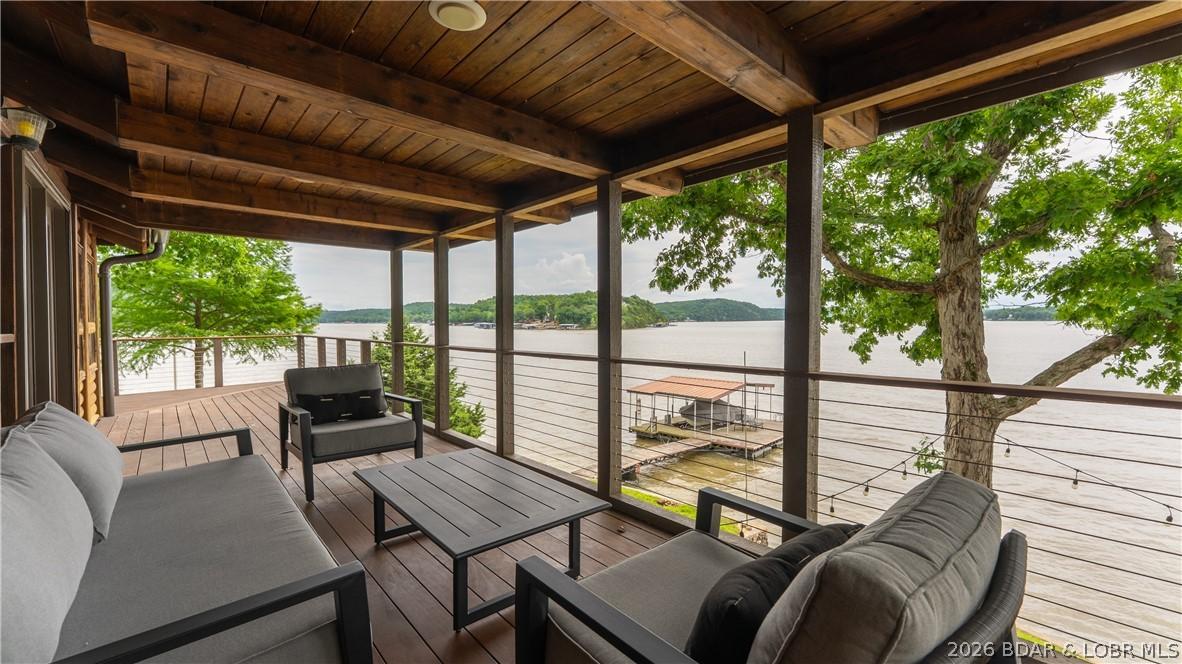 Image 4: Covered porch is perfect for those rainy days or w