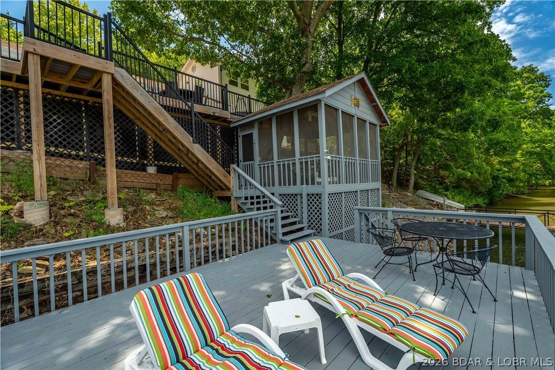 Image 4: Martini deck over the water and screened in patio